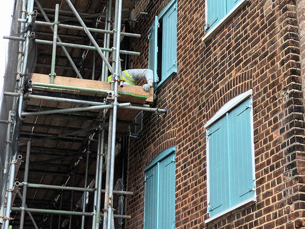 Scaffolding outside a brick building